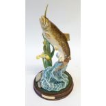 ROYAL DOULTON 'THE TROUT' CHINA GROUP, DA 172, 11 1/4" (28.6cm) high, printed mark, on a green plush