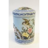 A CHINESE PORCELAIN CYLINDRICAL COVERED JAR BEARING A SIX CHARACTER YONGZHENG (1723 - 35) REIGN MARK