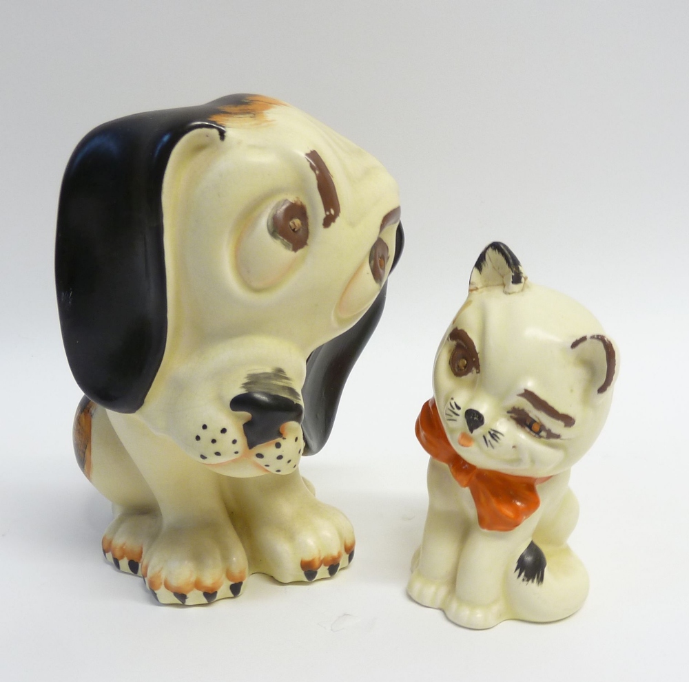 TWO CROWN DEVON POTTERY COMICAL MODELS OF A SEATED DOG AND CAT, the dog 8" (20.3cm) high, the cat 6"