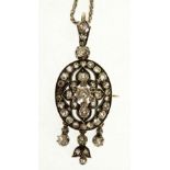 VICTORIAN DIAMOND SET PENDANT BROOCH, the pierced oval shaped pendant centre set with an old cut