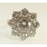 18CT WHITE GOLD, NINE STONE DIAMOND CLUSTER RING, eight claw set with a round brilliant cut diamond,