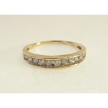 9CT GOLD ELEVEN STONE DIAMOND HALF ETERNITY RING, channel set with eleven graduated diamonds, 0.03ct