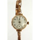 LADIES 9CT GOLD CASED WRIST WATCH, mechanical movement, with white porcelain Arabic dial, with