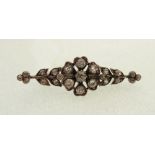 VICTORIAN GOLD AND DIAMOND SET FLORAL BROOCH, the central flower set with seven old cut diamonds,