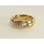 GENT'S 9CT GOLD THREE STONE DIAMOND RING, bezel set with an old cut diamond, 0.50ct approx., flanked
