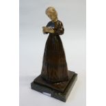 ENDSTORFER, EARLY TWENTIETH CENTURY BROWN PATINATED BRONZE AND IVORY FIGURE OF A LADY with plaited