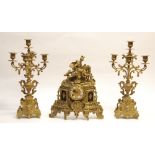 20TH CENTURY CAST BRASS THREE PIECE CLOCK GARNITURE IN THE ROCOCO TASTE, the mantle clock with 3 1/