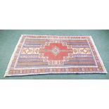 GOLPAYEGAN RUG.  With stepped rectangular centre medallion in brick red,  on a small fawn field with