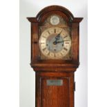 PRESTONS LTD. EARLY TWENTIETH CENTURY OAK SMALL LONGCASE CLOCK,  the 8 1/4" dial with pierced cherub