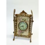 A VICTORIAN GILT METAL AND POTTERY OBLONG EASEL TYPE MANTEL CLOCK, the circular dial inset into a