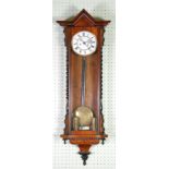 LATE VICTORIAN FIGURED WALNUT CASED VIENNA WALL CLOCK, the 6 1/2" two part enamelled Roman dial (