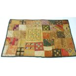 TWENTIETH CENTURY INDIAN HAND WORKED THROW, worked with small mirrored panels and coloured