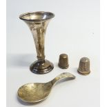 PLAIN SILVER CADDY SPOON, maker B. Torr, London 1977 and small WEIGHTED SILVER TRUMPET VASE, 3 1/