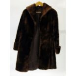 A LADY'S  RICH LUSTROUS BROWN COLOURED BEAVER LAMB FULL LENGTH COAT, with shawl collar with double