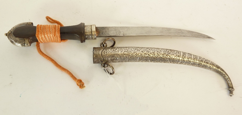 MIDDLE EASTERN JAMBIYA WITH CURVED DOUBLE EDGE BLADE, waisted hardwood hilt with foliate scroll