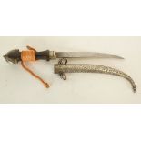 MIDDLE EASTERN JAMBIYA WITH CURVED DOUBLE EDGE BLADE, waisted hardwood hilt with foliate scroll