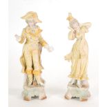 PAIR OF CONTINETNAL TINTED BISQUE FIGURES, yellow and gilt, modelled as a courtier and lady, she