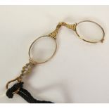 ENGRAVED ROLLED GOLD LORGNETTE, on black cord