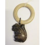 GEORGE VI CHILDS IVORINE TEETHING RING with silver squirrel shaped rattle attached, the rattle 1 3/