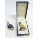 HALCYON DAYS PORCELAIN "HOGARTHS PUG" depicted seated on oval dark blue and gilt base, 3 1/4" (8.