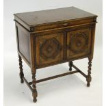 APOLLO SPRING DRIVEN GRAMOPHONE, with record storage alongside, in carved oak cabinet with hinged