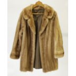 A LADY'S  LIGHT BROWN PASTEL MINK THREE QUARTER LENGTH FUR COAT, revered collar, double breasted