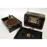 A PRE-WAR H.M.V. SUITCASE GRAMOPHONE with wind-up mechanism, in black leatherette case and a