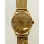 A DELBANA AUTOMATIC 18k GOLD CASED GENTLEMAN'S WRIST WATCH, with date aperture, the 57 jewelled