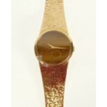 LADYS 9CT GOLD CASED BUECHE GIROD WRIST WATCH, mechanical movement, tigers eye dial with gold hands,