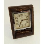 1930'S LE COULTRE CHROMIUM CASED PORTABLE BEDSIDE TIMEPIECE in outer hinged supporting leather