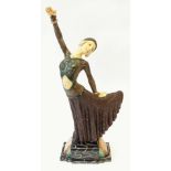 REPRODUCTION ART DECO COMPOSITION FIGURE OF A FEMALE  DANCER, modelled in stylised pose, on a marble