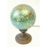 ART DECO STYLE PATINATED METAL TABLE LAMP with iridescent blue glass globular shade and circular