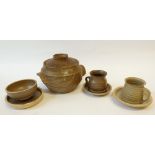 TWO STEPHEN LLEWLLYN STONEWARE PART TEA SERVICES, comprising 13 cups of two designs, 12 saucers, two