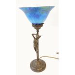 ART NOUVEAU STYLE PATINATED METAL FIGURAL TABLE LAMP with mottled blue and black glass shade, 15" (