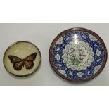 A PERSIAN ENAMELLED ON METAL SMALL CIRCULAR PLAQUE, intricately decorated with birds on a
