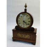 REGENCY ROSEWOOD AND BRASS INLAID MANTEL CLOCK, the 6 1/2" enamelled roman dial powered by a