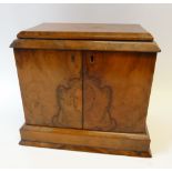 VICTORIAN BURR WALNUTWOOD TABLE TOP CABINET, the oblong chamferred top above a pair of doors,