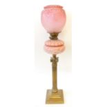 VICTORIAN BRASS TABLE LAMP, with moulded pink glass reservoir and etched pink glass shade, raised