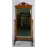 LATE VICTORIAN LIGHT OAK AND EBONISED CHEVAL MIRROR, the oblong, bevel edged plate in a moulded