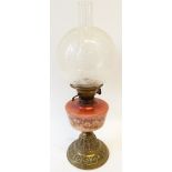 VICTORIAN BRASS AND GLASS OIL LAMP, with pink glass and floral enamel decorated reservoir on stepped