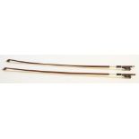 TWO MODERN STUDENTS VIOLIN BOWS, each with octagonal stick, leather and silver wire bound grip,