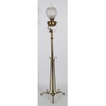 LATE NINETEENTH CENTURY FLOOR STANDING TELESCOPIC BRASS OIL LAMP, of typical form with later acid