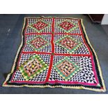 EASTERN PATCHWORK QUILT, THE DESIGN DIVIDED INTO SIX SQUARES, EACH WITH A MULTI COLOURED DIAMOND