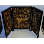 INTERESTING CHINESE PROFUSELY CARVED GILT WOOD TRIPTYCH TYPE SCREEN, the centre section depicting