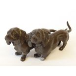 SMALL BRONZE GROUP OF TWO DACHSHUNDS, 3 ½" (8.9cm) long (one front paw af)