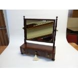 EARLY NINETEENTH CENTURY FIGURED MAHOGANY TOILET MIRROR, the oblong plate, in a  moulded frame,