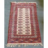 BOKHARA RUG with two rows of gulls on a fawn field, multiple border stripes, 4' 10" x 3' 1"