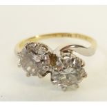 TWO STONE DIAMOND CROSSOVER RING, the eight claw set round brilliant cut diamonds of 1.55ct