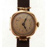 LADY'S 9CT GOLD CASED WRIST WATCH, Swiss movement, with gilt sunburst arabic dial, cushion shaped