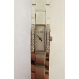 LADY'S GUCCI DIAMOND SET STAINLESS STEEL WATCH, oblong mother of pearl dial, case set with two